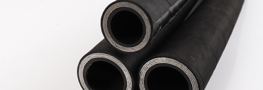 What is the material of the hose assembly?